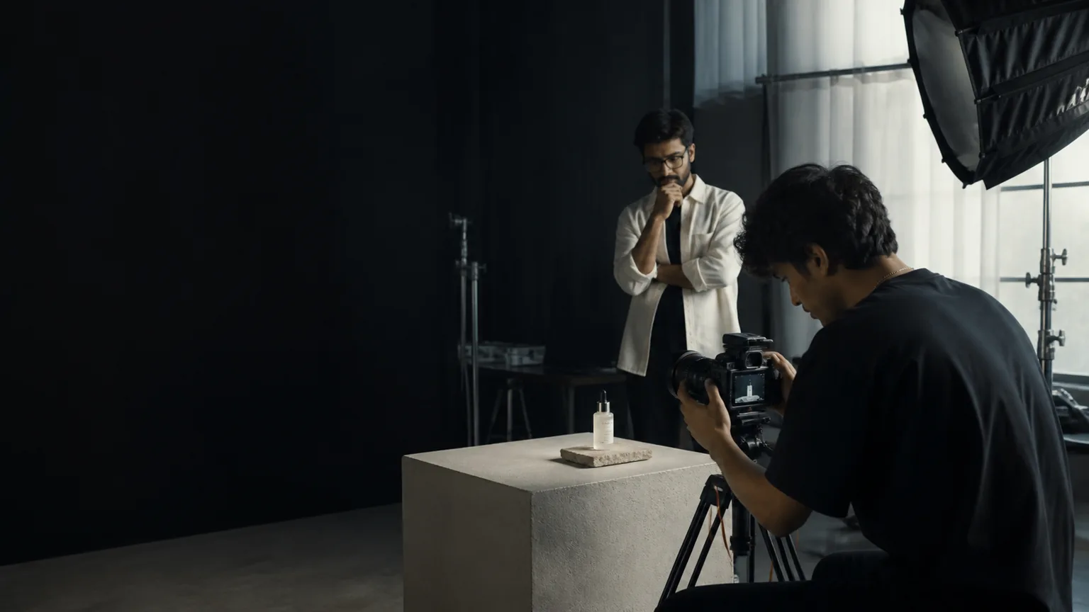 Creator and brand-side collaborator working together on a product shoot